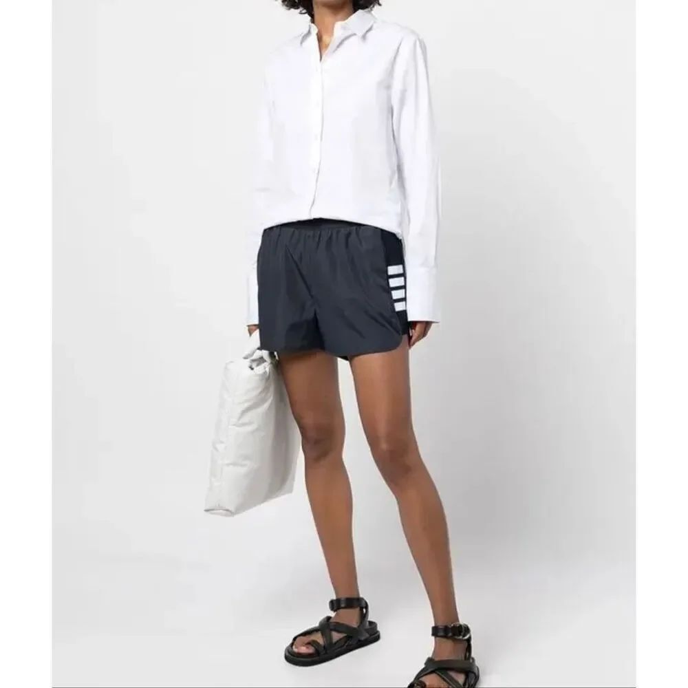 Thom Browne Flyweight Tech 4-Bar Running Shorts | Navy in 5